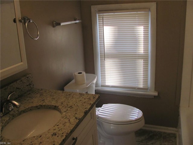 bathroom with vanity and toilet