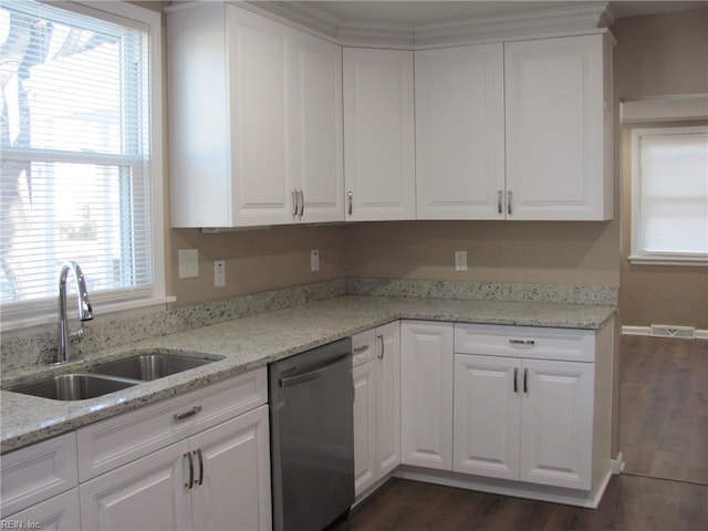 kitchen with sink, stainless steel dishwasher, plenty of natural light, light stone countertops, and white cabinets