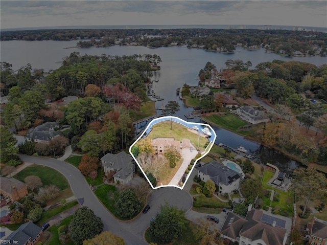 drone / aerial view featuring a water view and a residential view