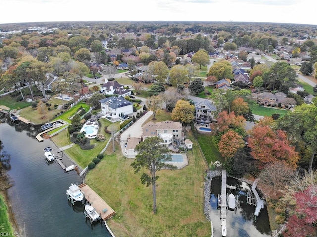 birds eye view of property featuring a residential view and a water view