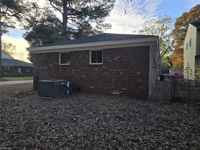 property exterior at dusk with central AC