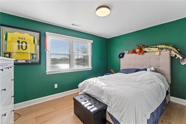 bedroom with light hardwood / wood-style floors