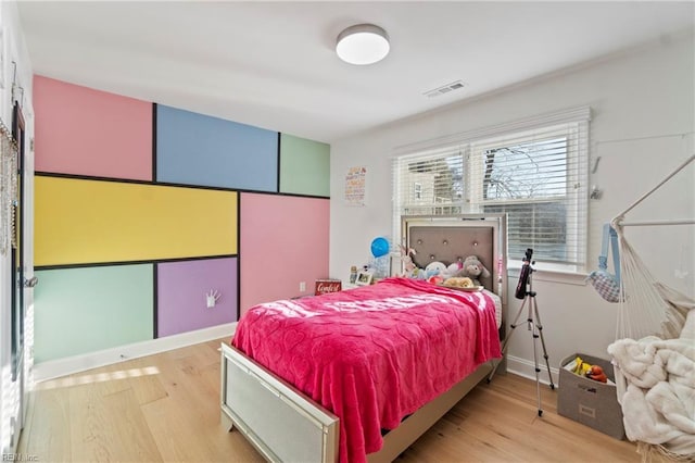 bedroom with light hardwood / wood-style flooring