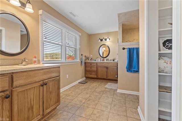 bathroom featuring vanity and tile patterned flooring