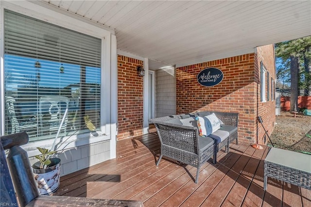 deck with an outdoor hangout area