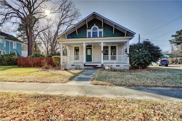 view of front of home with a front lawn and covered porch