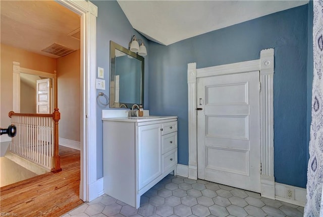 bathroom with vanity and tile patterned flooring