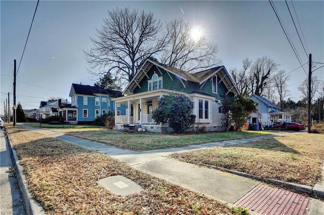 view of front of house featuring a porch and a front yard