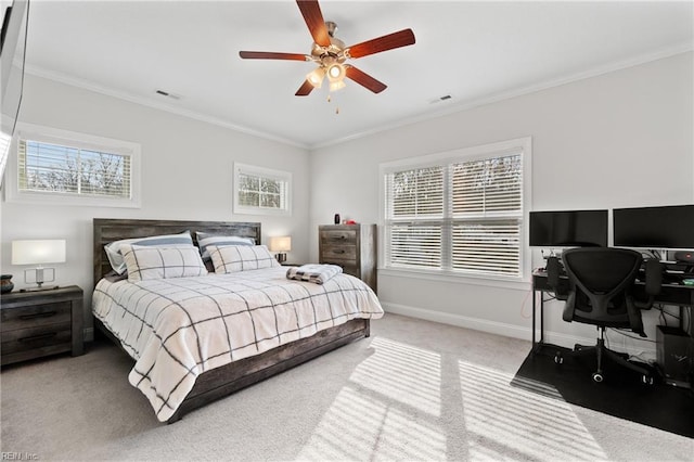 carpeted bedroom with multiple windows, ornamental molding, and ceiling fan