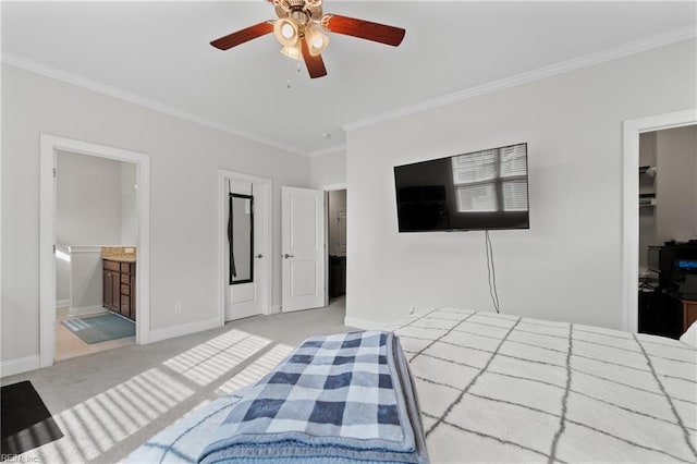 carpeted bedroom with ceiling fan, ornamental molding, and connected bathroom