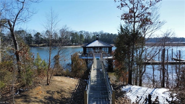 dock area with a gazebo and a water view