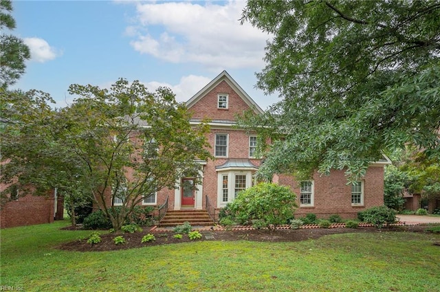 view of front of house with a front lawn