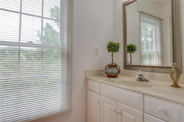 bathroom with a healthy amount of sunlight and vanity