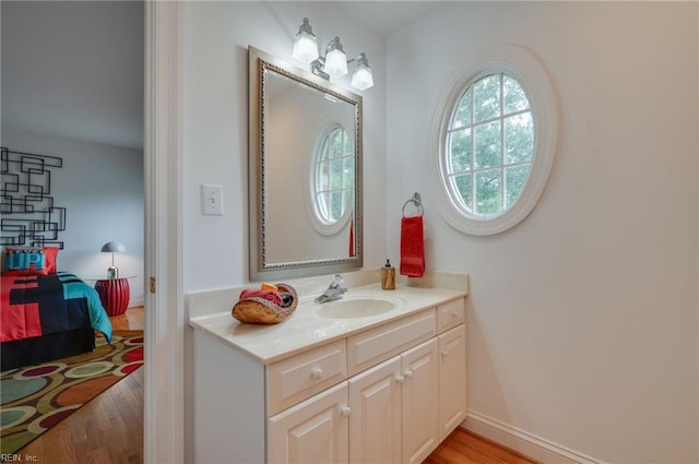 bathroom with vanity and hardwood / wood-style floors