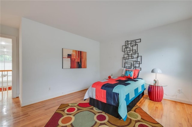 bedroom with light wood-type flooring