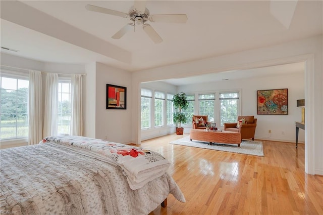 bedroom featuring ceiling fan and light hardwood / wood-style flooring