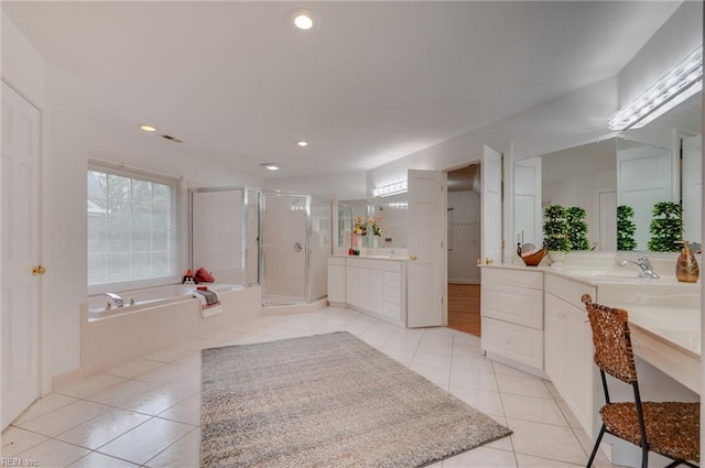 bathroom with tile patterned floors, independent shower and bath, and vanity