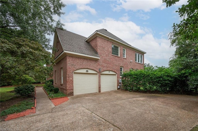 view of side of home featuring a garage