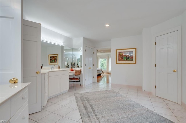 bathroom featuring tile patterned floors and vanity