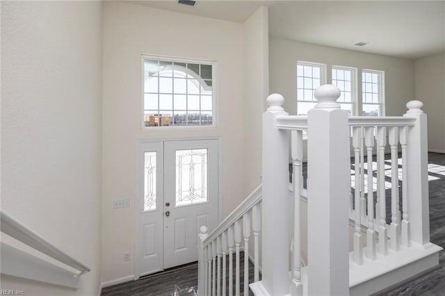 entrance foyer with dark hardwood / wood-style floors