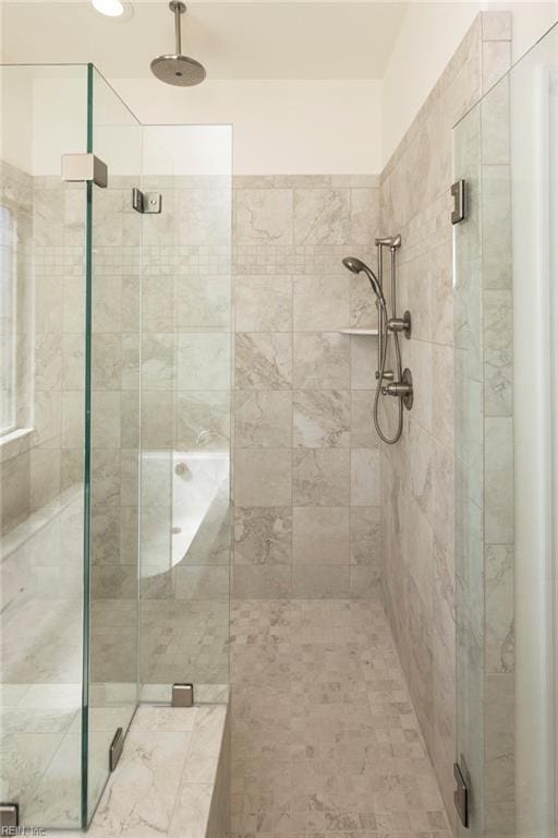 bathroom featuring an enclosed shower