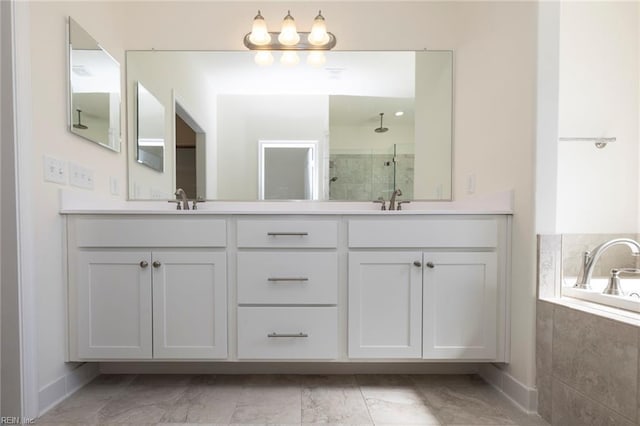 bathroom with independent shower and bath and vanity