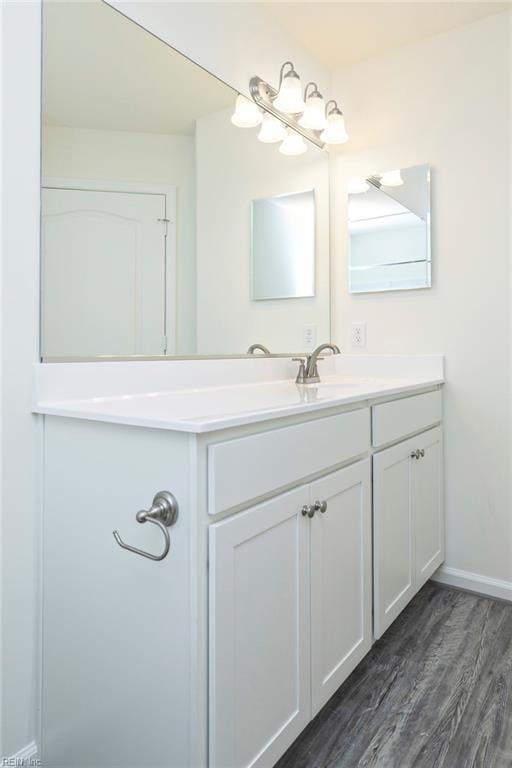 bathroom with vanity and hardwood / wood-style floors