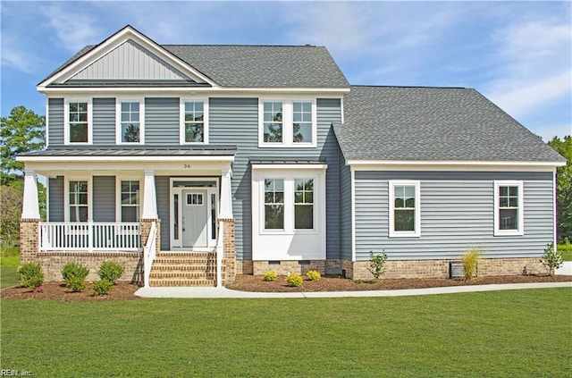 craftsman-style home featuring a porch and a front lawn