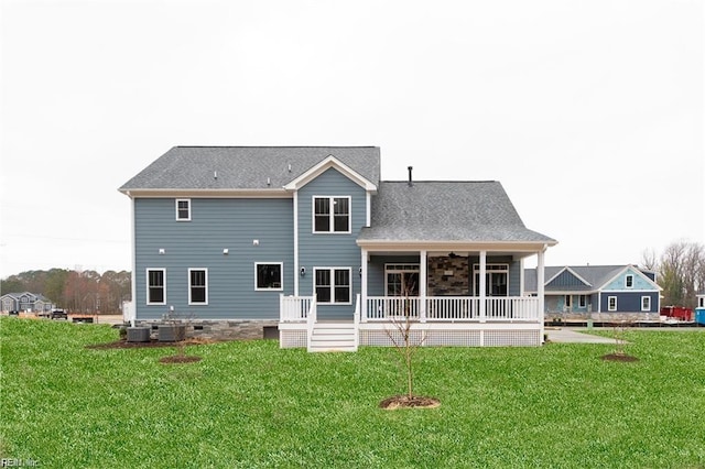 back of property featuring a porch, a yard, and cooling unit