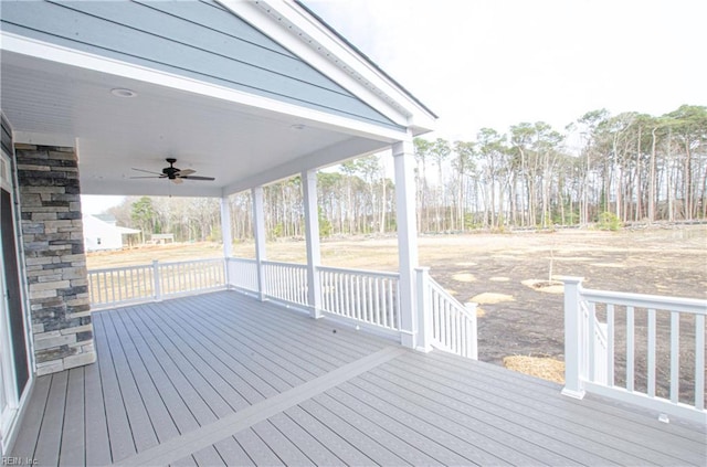 wooden deck featuring ceiling fan