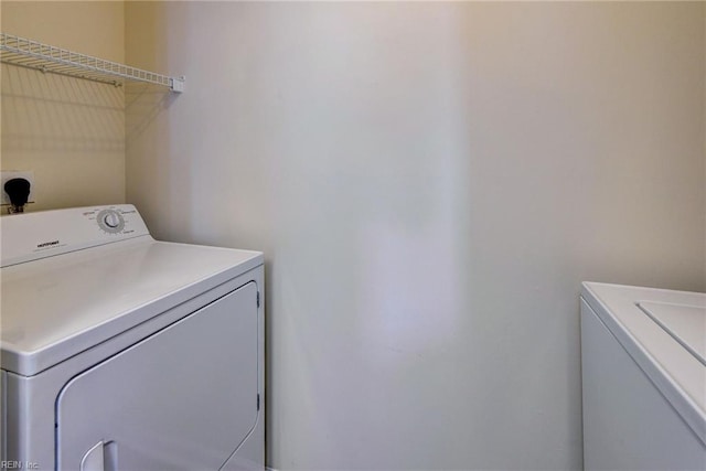 laundry room featuring separate washer and dryer