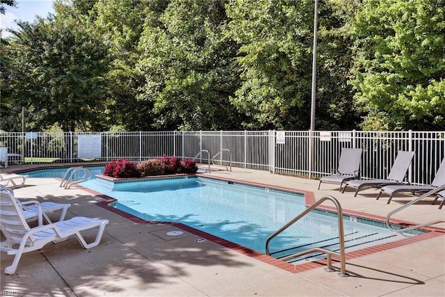 view of swimming pool with a patio