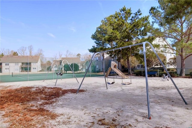 view of jungle gym with tennis court