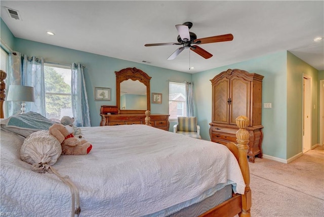 bedroom featuring light carpet and ceiling fan