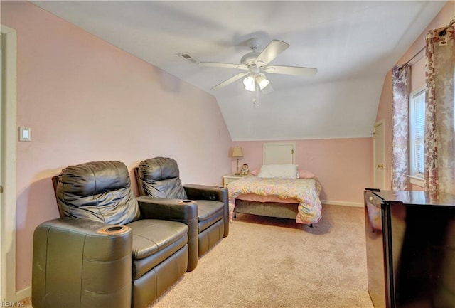 carpeted bedroom with ceiling fan and vaulted ceiling