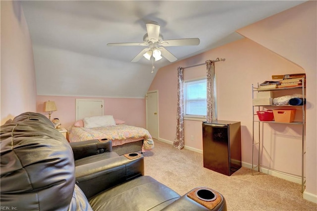 carpeted bedroom with vaulted ceiling and ceiling fan