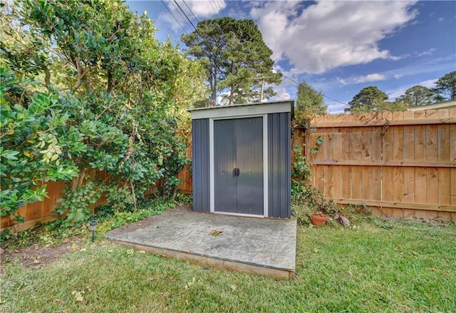 view of outbuilding featuring a lawn