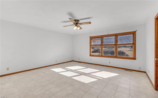 spare room with ceiling fan