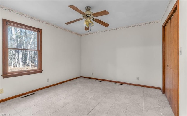 spare room with ceiling fan