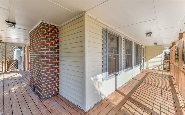 wooden terrace featuring a porch