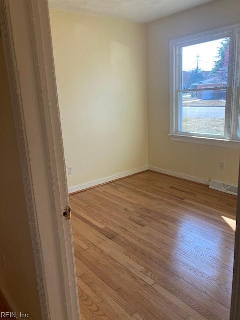 unfurnished room with light hardwood / wood-style floors