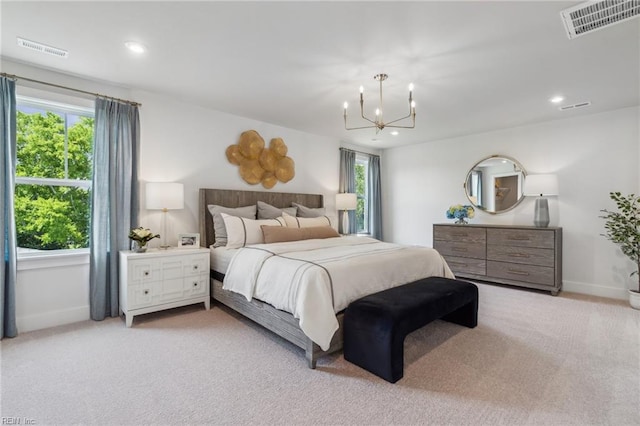 carpeted bedroom with multiple windows and a notable chandelier