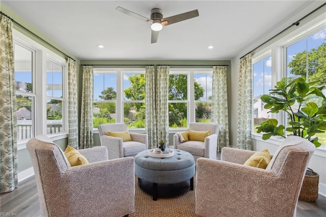 sunroom featuring ceiling fan