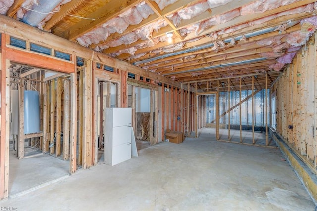 basement featuring white refrigerator