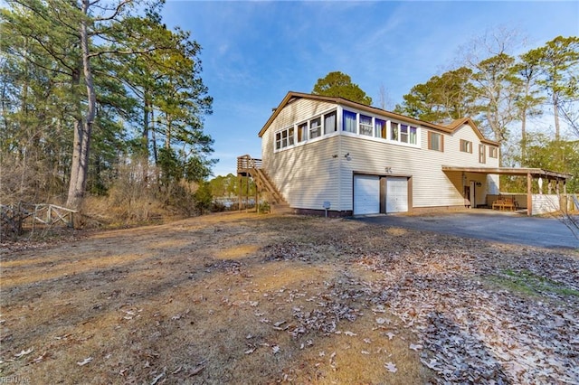 view of front facade featuring a garage and a carport