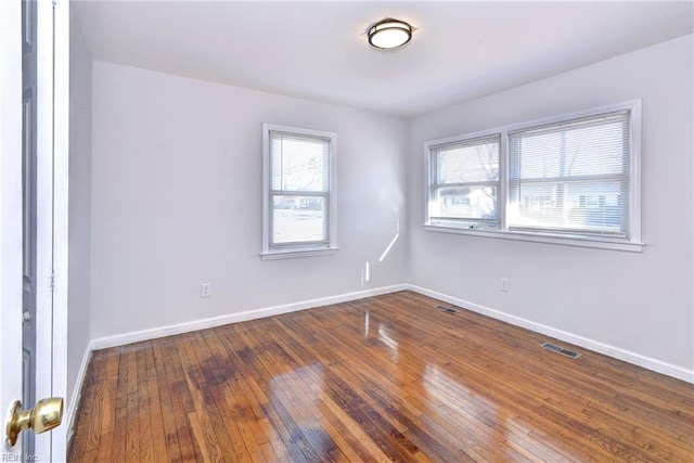 empty room with wood-type flooring