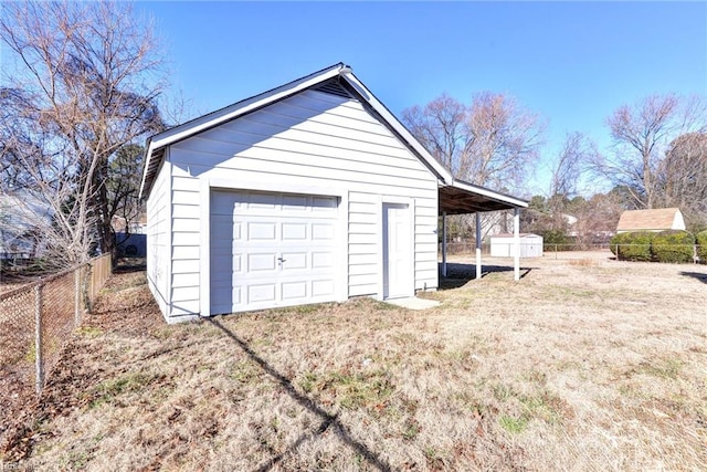 garage featuring a yard