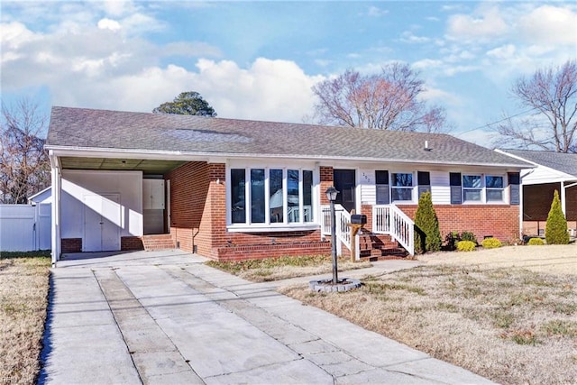 ranch-style home with a carport and a front lawn