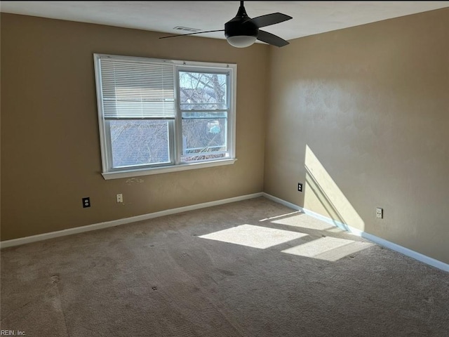 unfurnished room featuring light carpet and ceiling fan