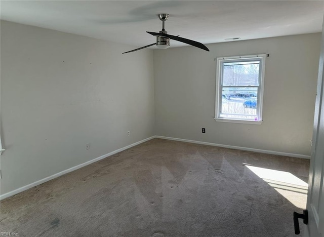 empty room with light colored carpet and ceiling fan